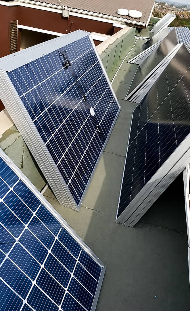 Solar panel installation in progress on site in Abuja, Nigeria, building a reliable renewable energy system for uninterrupted power supply across homes and businesses in Nigeria.