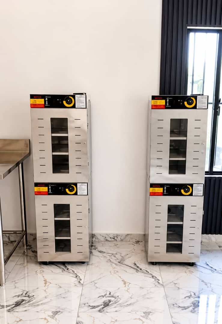 Installation of commercial electric food dehydrators in Abuja, Nigeria, used for drying and preserving food items at controlled temperatures. These multi-tray stainless steel units support efficient, large-scale food processing for businesses looking to extend shelf life and maintain product quality.